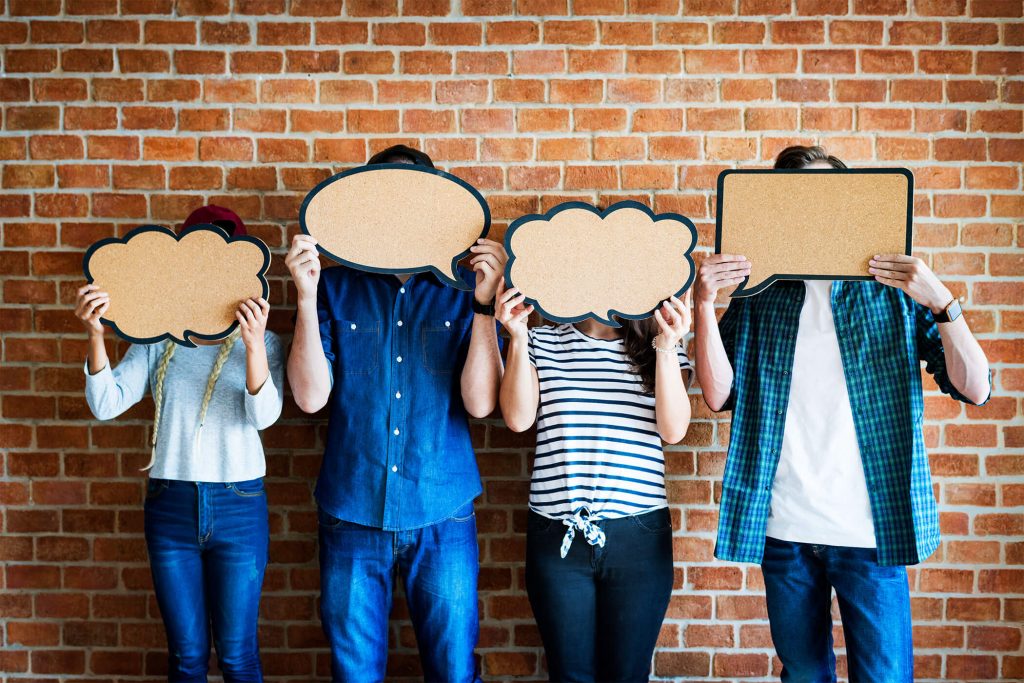 People Holding Speech Bubbles