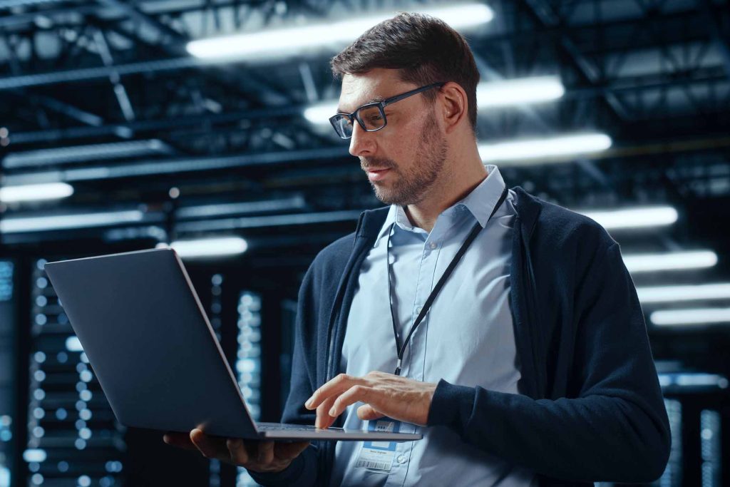 IT security engineer working on laptop